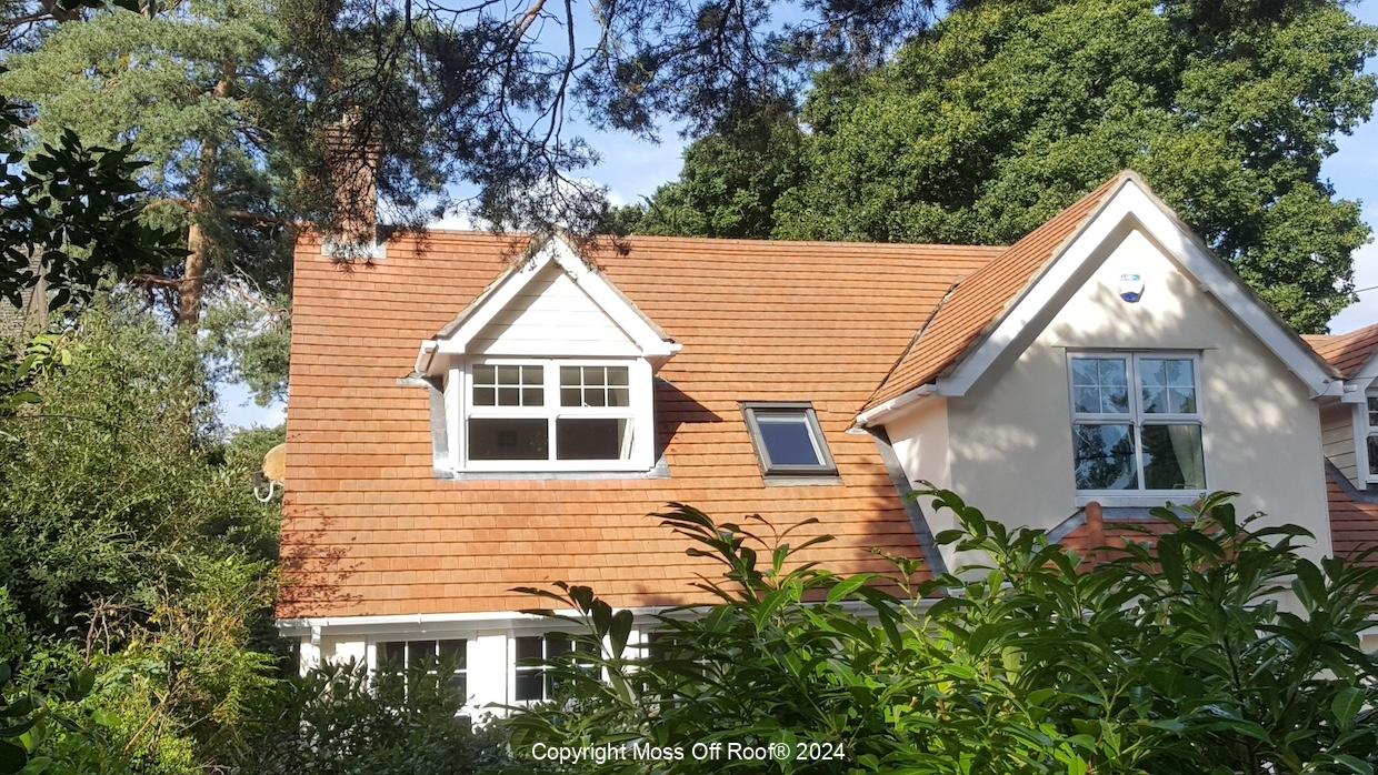 Cream home with dormer and newly cleaned red tiled roof