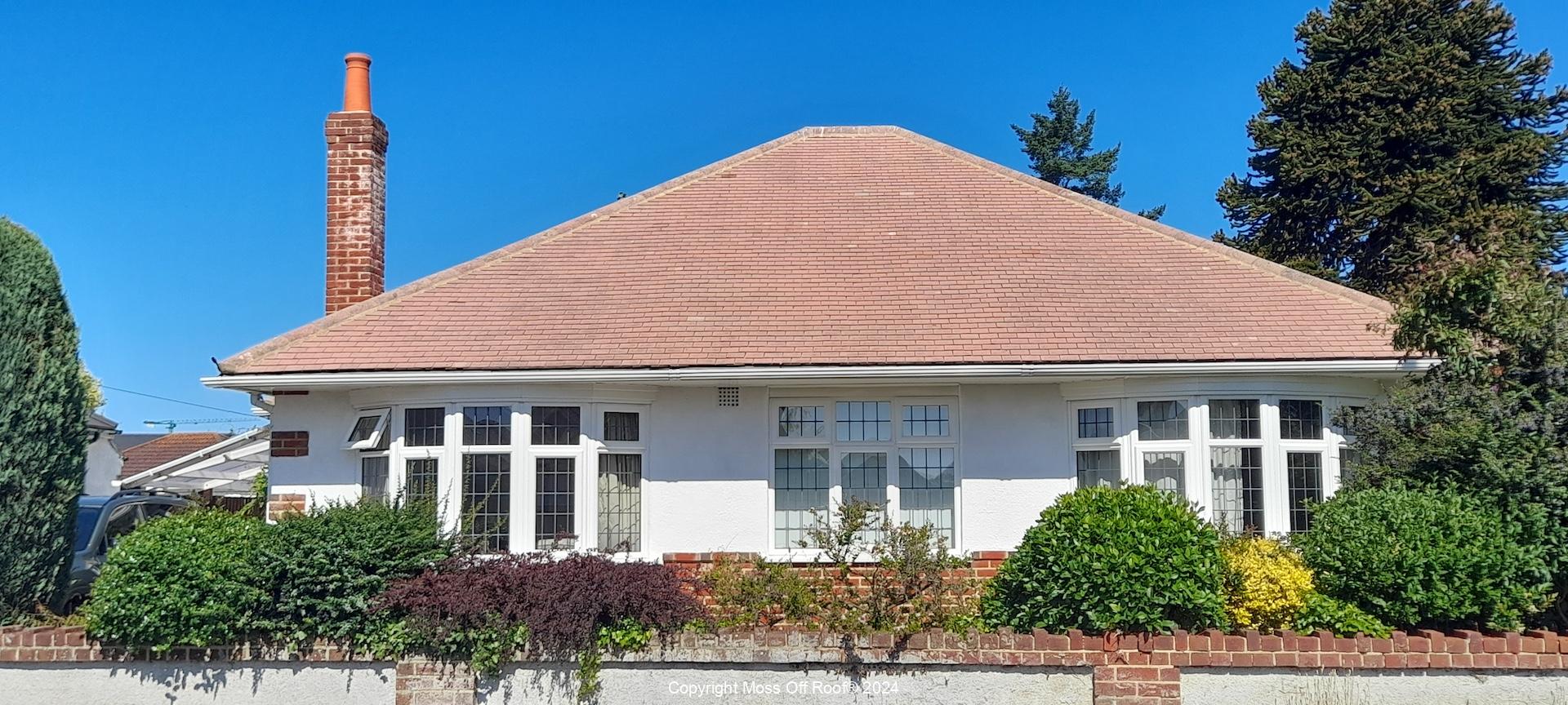 Red tiled roof fully cleaned on cream rendered house